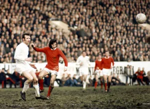 George Best of Manchester United seen here in action against Paul Reaney of Leeds circa