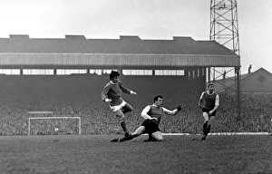 George Best scores a goal for Manchester United past Sheffield Wednesday defender Johnny