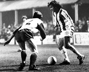George Best takes on Jim Melrose in a first-half move during the Nuneaton Borough charity