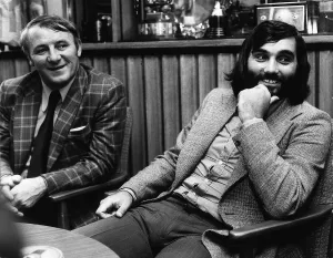 George Best Tommy Docherty both ex footballers sitting talking March 1974