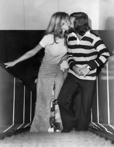George Best and Toni Ceo photographed at Heathrow Airport. August 1974 P003802