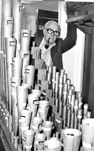 George Blake of the Cleveland Organ Society with the trumpet pipes of the Wurlitzer organ