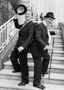 George Cole and Dennis Waterman at Minder photocall dancing on steps 04 / 12 / 1988