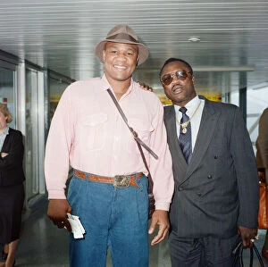 01524 Collection: George Foreman and Joe Frazier at London Airport. 16th October 1989