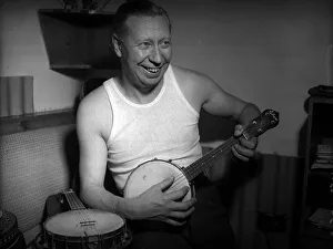 Musical Instruments Prints: George Formby comedian actor playing his ukulele in 1953 A©mirrorpix