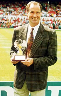 George Graham Arsenal manager holding Barclays manager award trophy
