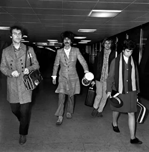 00059 Prints: George Harrison of the Beatles at Heathrow airport where he arrived from India where he