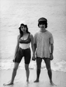 Core08 Prints: George Harrison of the Beatles with his new wife Patti Boyd on a beach February 1966