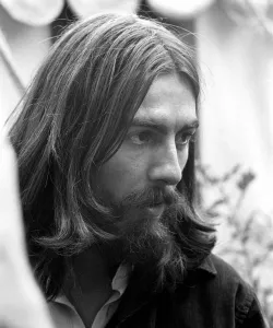 George Harrison of the Beatles pictured amongst the Buddhist American group