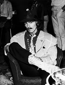 George Harrison of the Beatles sitting in a chair in the Atlantic Hotel in Newquay where