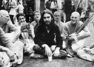George Harrison with members of the 12 strong Radha Krishna Temple at a press reception