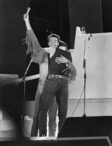 00326 Prints: George Michael and Andrew Ridgley (left) of pop duo Wham! on stage for the final embrace