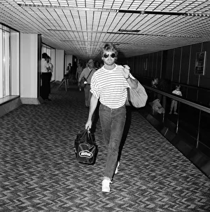 Striped Prints: George Michael arriving at Heathrow airport from Los Angeles where he has been on holiday