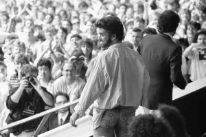 Audience Prints: George Michael in the audience during the opening of the Live Aid Concert at Wembley