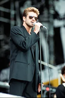George Michael performing on stage at the Nelson Mandela 70th Birthday Tribute concert