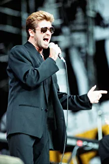 George Michael performing on stage at the Nelson Mandela 70th Birthday Tribute concert