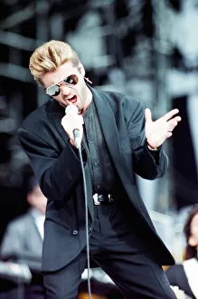 George Michael performing on stage at the Nelson Mandela 70th Birthday Tribute concert