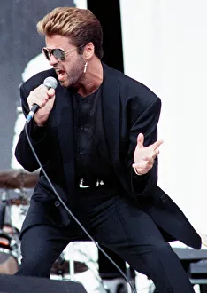 George Michael performing on stage at the Nelson Mandela 70th Birthday Tribute concert
