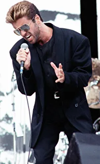 George Michael performing on stage at the Nelson Mandela 70th Birthday Tribute concert