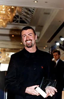 GEORGE MICHAEL, SINGER WITH HIS CAPITAL RADIO AWARD FOR BEST MALE SINGER 1995