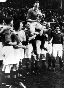 Celebrating Prints: George Young Glasgow Rangers Captain is held aloft by team mates after winning the 1953