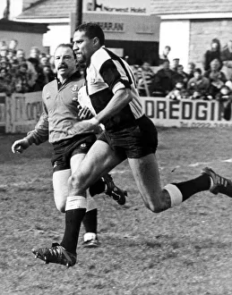 Gerald Cordle the Cardiff Winger goes through the Llanharen defence to score Cardiff