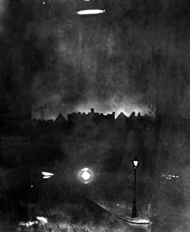 Zeppelin Prints: The German airship SL-11 caught in the beams of a searchlight shortly before it was shot