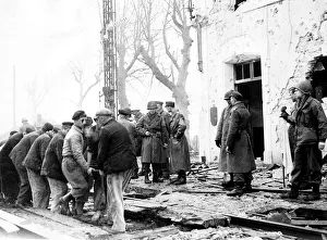 Repairing Prints: German American and French officers watch workmen replace the railway lines so that
