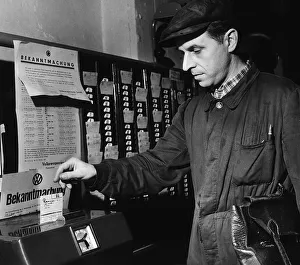 German Car Worker Heinrich Gemnich December 1953 clocks on at the Volkswagen car