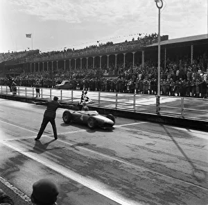 German driver Wolfgang Taffy'von Trips taking his Ferrari Dino 156 car past