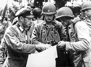German officer (a Georgian) explaining details of a military map to US officers from
