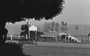 01462 Prints: German shells explode harmlessly in the English Channel off the coast at Lea Cliff