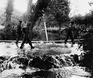 D Day Prints: German snipers being escorted across the Odon river after capture in the Odon valley