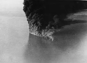Target Prints: A German tanker ablaze to the water line after an attack by RAF Coastal Command in