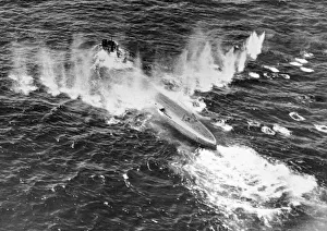 A German U-boat caught in a hail of gunfire and bombs dropped by a Sunderland flying boat