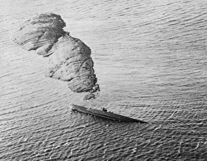 Rocks Prints: German Uboat U1060 seen here a grounded in the Norwegian Sea south-west of Bronnoysund