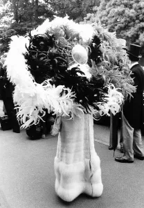 00180 Prints: Gertrude Shilling in feather hat at Royal Ascot in June 1976