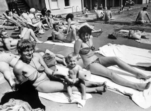Lido Prints: Getting a tan beside Clifton swimming pool are Heidi Hopkins with her 18-month old son