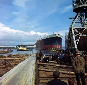 Tanker Prints: Giant Oil Tanker Myrina launched at Belfast watched by the dock workers. September 1967
