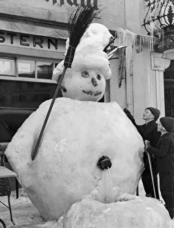 00089 Prints: Giant snowman built over a public water tap in the centre of St Moritz, Switzerland