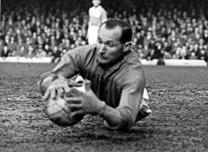 00469 Prints: Gilbert Merrick Birmingham City Goalkeeper in action March 1957. a. k. a. Gil Merrick