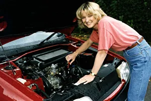 Gillian Taylforth actress Eastenders star looking under bonnet of a Citroen diesel prior