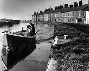 Lancashire Prints: A girl and her dog on a peaceful boat trip on the Leeds and Liverpool canal near Ormskirk