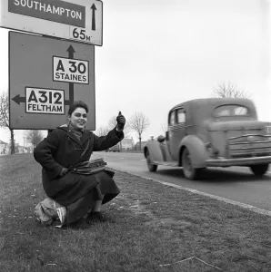 Girl hitch-hiking on the A30. to Southampton Circa 1957