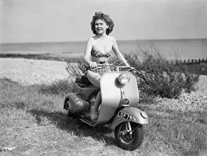Girl Collection: A girl on a Vespa motor scooter. 1952