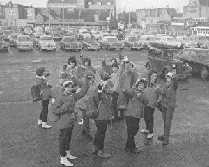 Girls of Barkers Butts School, Coventry, wave a cheery farewell before leaving Pool
