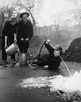 00204 Prints: Girls of the Hendon Civil Defence Corps who are training to be ambulance drivers go