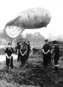 Praying Prints: Girls on a north west of England balloon barrage site join in morning prayers. WW2 1942