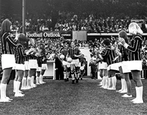 The girls from the Palace cheer leading group applaud Crystal Palace captain John Sewell