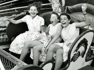 Fairground Prints: Three girls riding the Caterpillar at Margates Dreamland fun fair